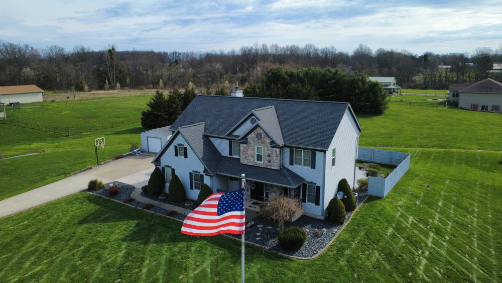 Aerial drone photo of a completed Firestone roofing project in Northeast Ohio
