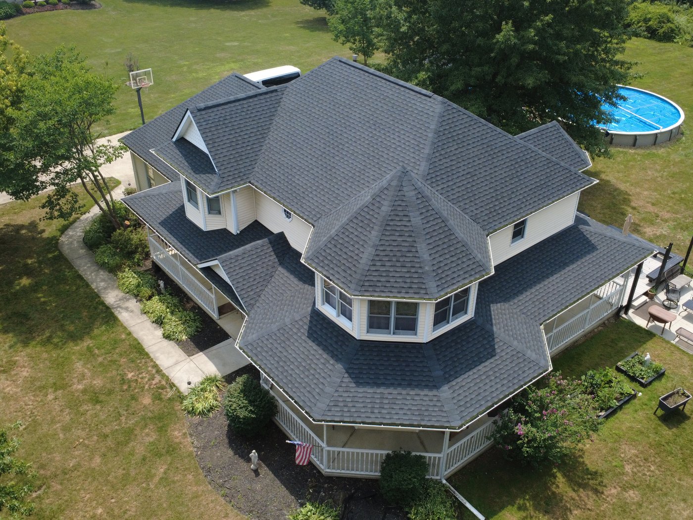 Drone photo of a finished shingle roof on a Copley home in Summit County, Northeast Ohio. Firestone Roofing & Restoration.