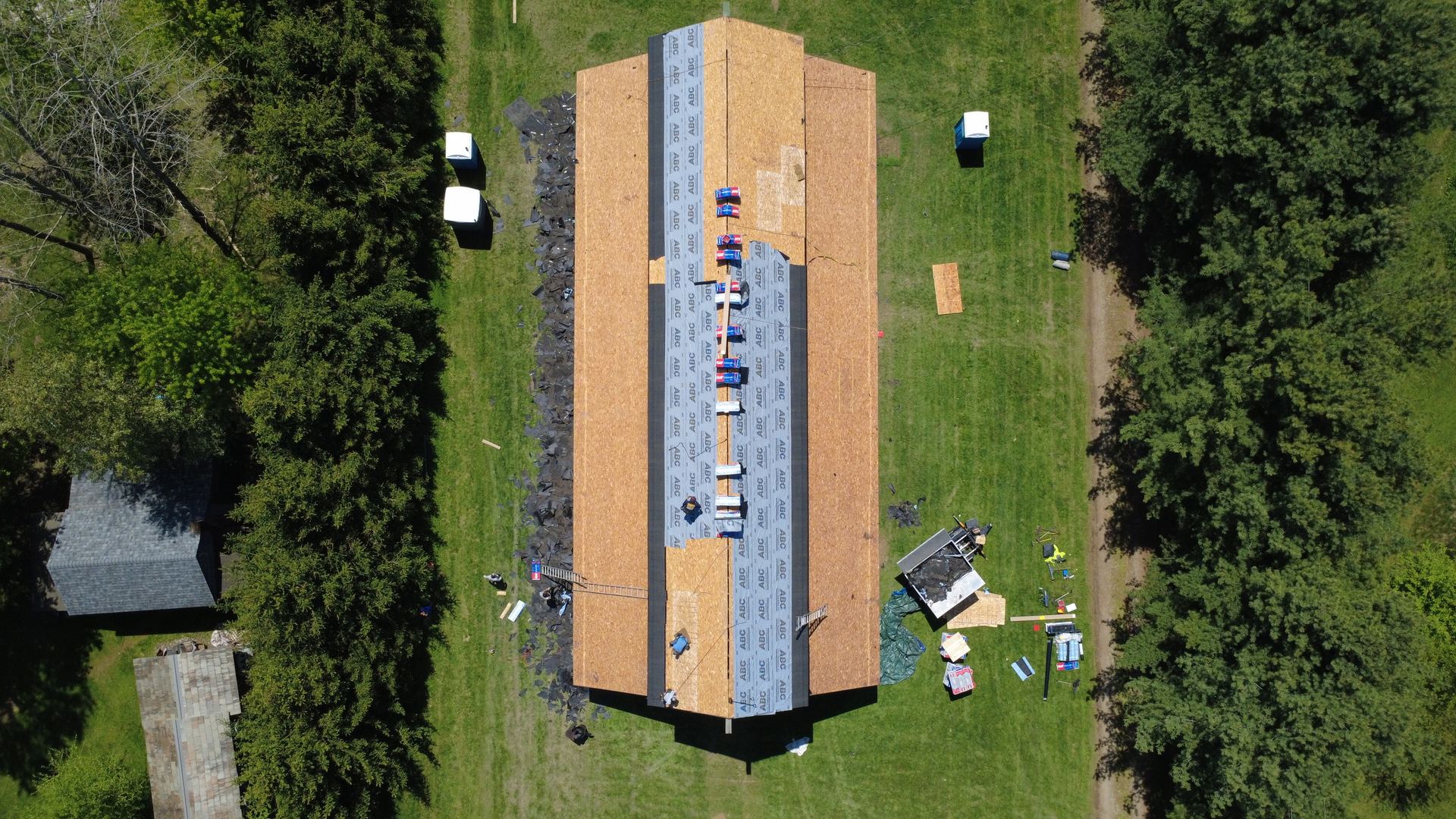 Firestone crew installing a roof, aerial drone view in Northeast Ohio