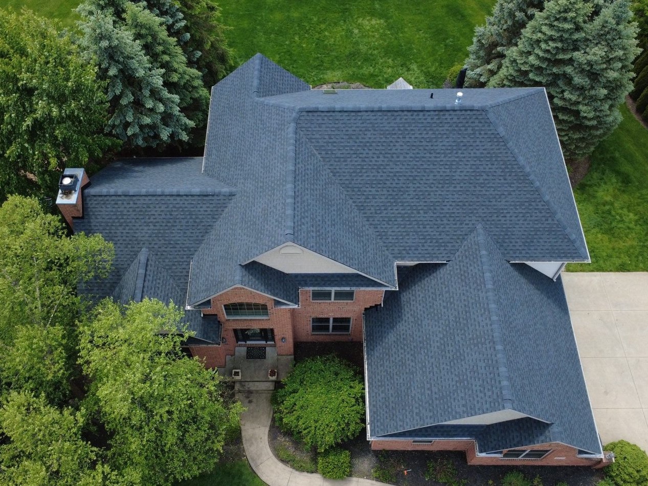 Aerial drone view of a completed roof replacement in North Canton, Ohio (Stark County) by Firestone Roofing & Restoration.