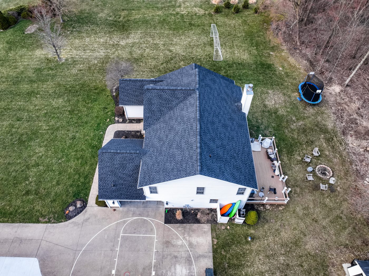 Aerial drone photo of a completed shingle roof on a Northeast Ohio home with an attached garage